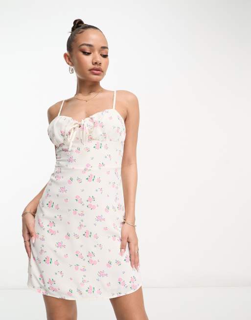 White dress with store pink flowers