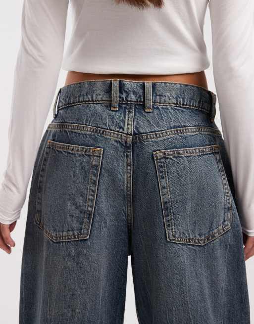 COLLUSION antifit mid rise jeans in mid blue marble