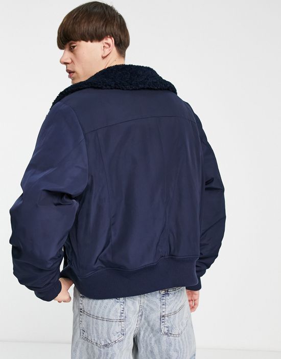 https://images.asos-media.com/products/collusion-bomber-puffer-jacket-with-sherpa-trims-in-navy/201016687-2?$n_550w$&wid=550&fit=constrain
