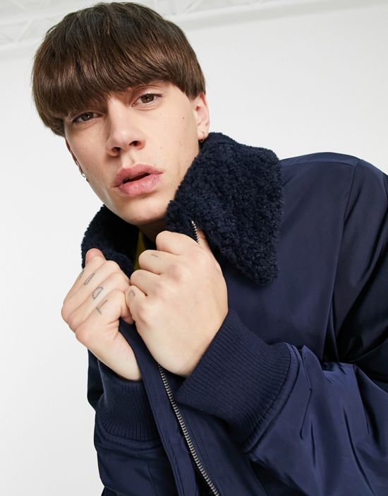 https://images.asos-media.com/products/collusion-bomber-puffer-jacket-with-sherpa-trims-in-navy/201016687-3?$n_550w$&wid=550&fit=constrain