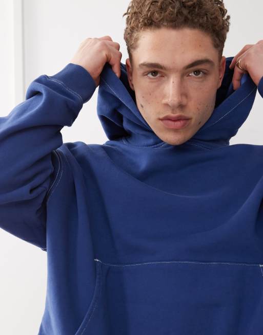 COLLUSION boxy cropped hoodie in navy blue with seam detail and print