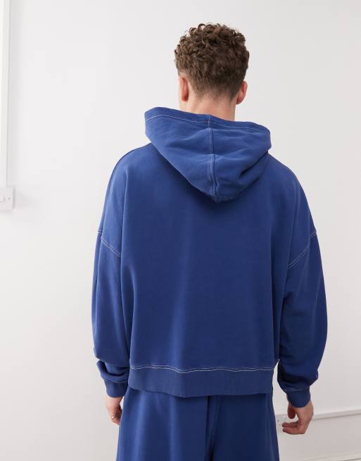 COLLUSION boxy cropped hoodie in navy blue with seam detail and print