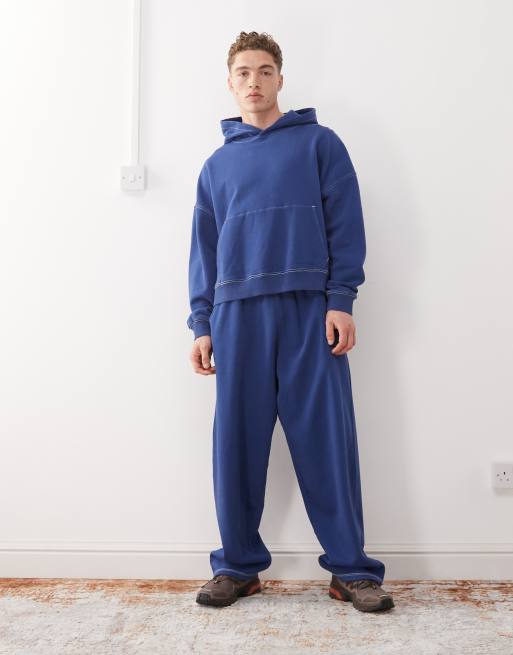 COLLUSION boxy cropped hoodie in navy blue with seam detail and print