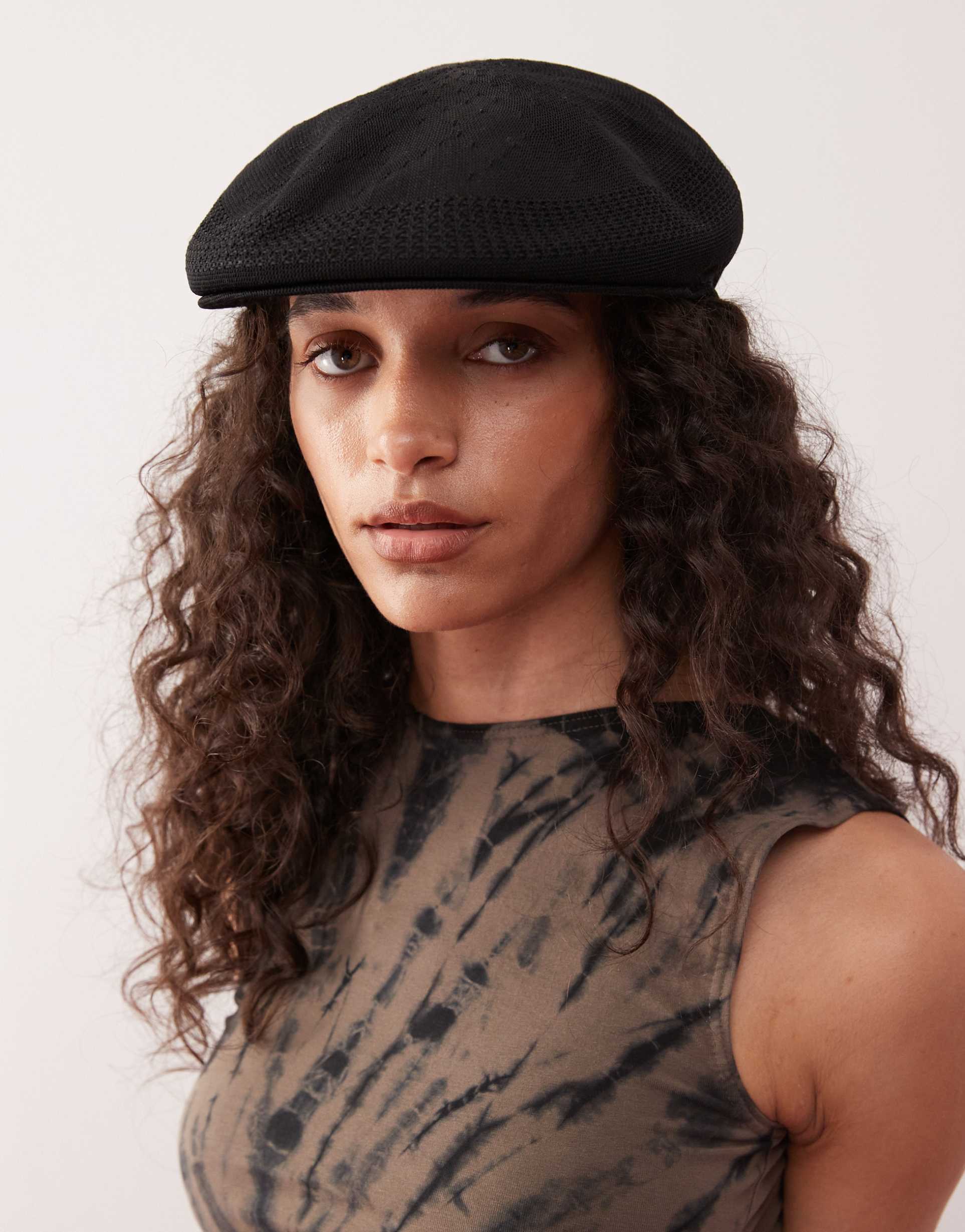 collusion branded flap cap in black