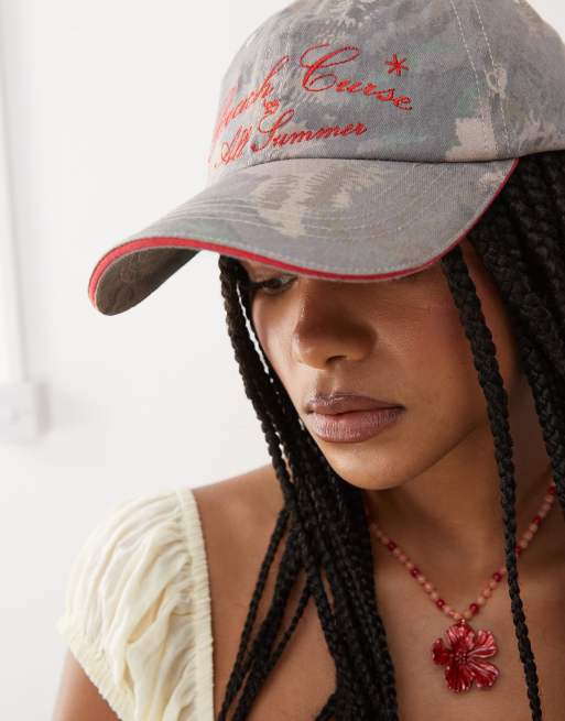 COLLUSION camp print slogan cap in multi