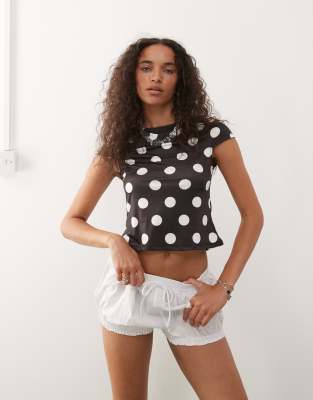 COLLUSION cap sleeve slash neck top in large black and white polka dot-Multi