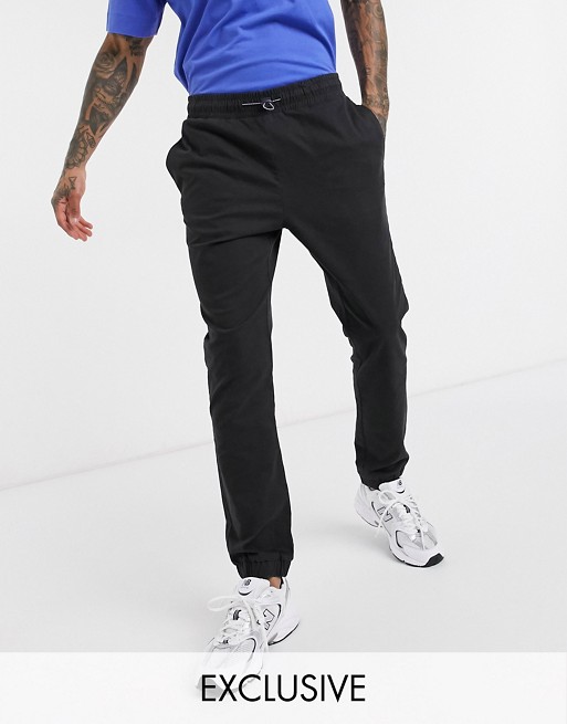 COLLUSION tapered woven jogger in black