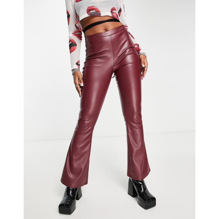 COLLUSION faux leather flare pants in burgundy