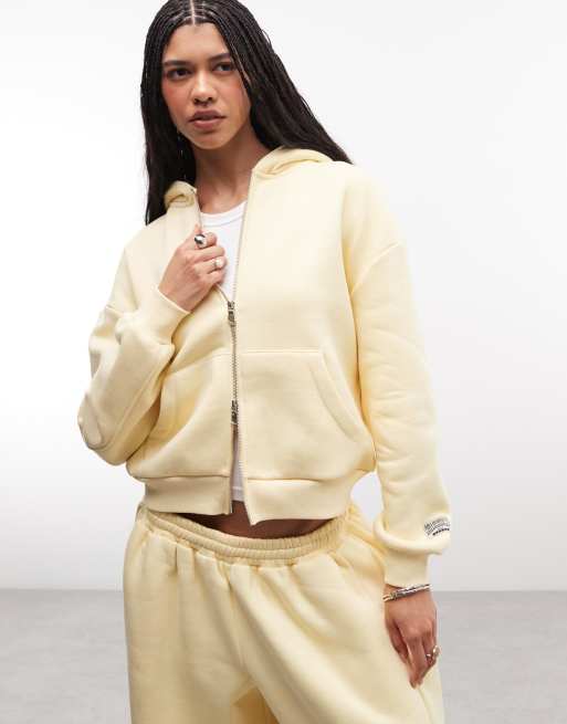 COLLUSION - Felpa con cappuccio squadrata color latticello con zip in coordinato