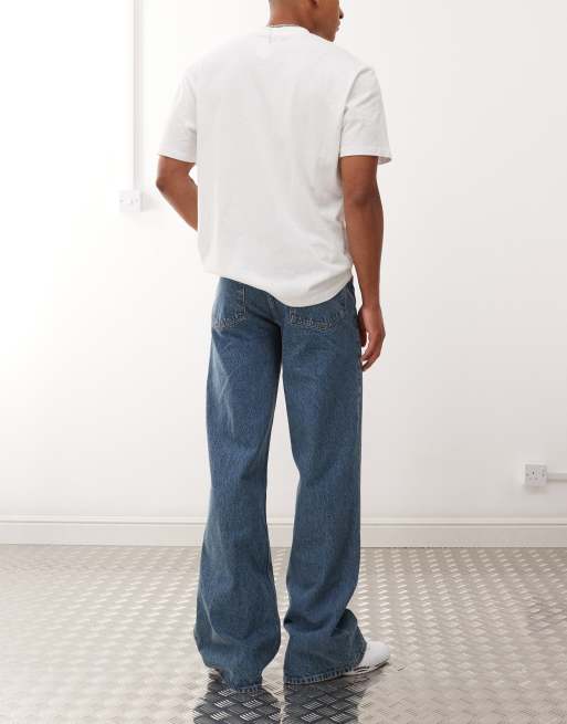 COLLUSION flare jeans in mid wash with tobacco stitching