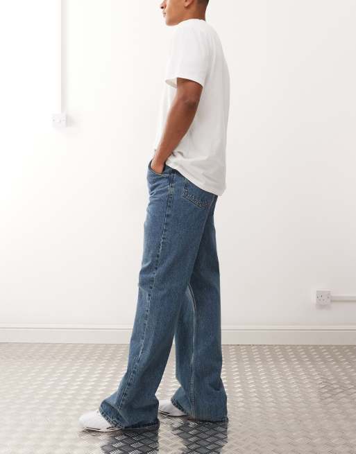 COLLUSION flare jeans in mid wash with tobacco stitching