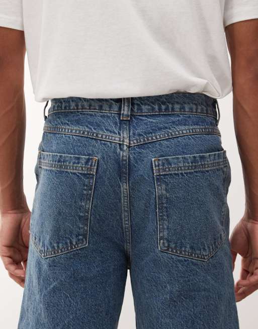 COLLUSION flare jeans in mid wash with tobacco stitching