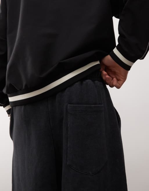 COLLUSION – Extrem weite Jogginghose in verwaschenem Schwarz