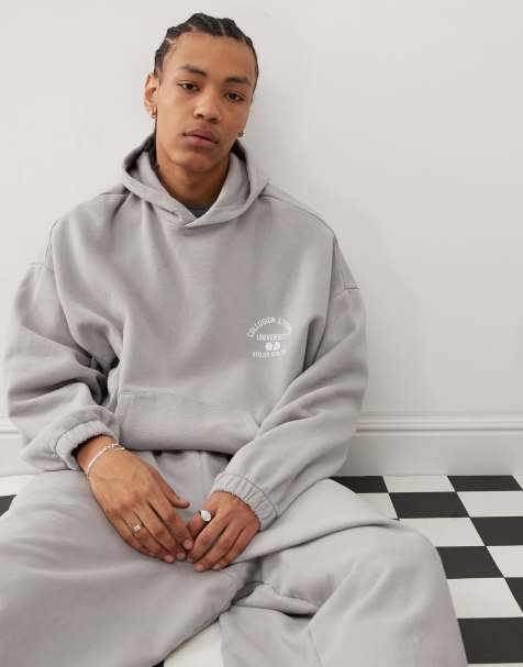 COLLUSION – Grauer Oversize-Kapuzenpullover mit Aufdruck und elastischen Bündchen - view 1