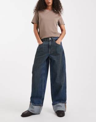 COLLUSION - Jeans in Dunkelblau mit Umschlagsaum