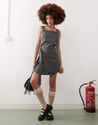 Collusion kilted mini pinny dress with buckle detail in grey