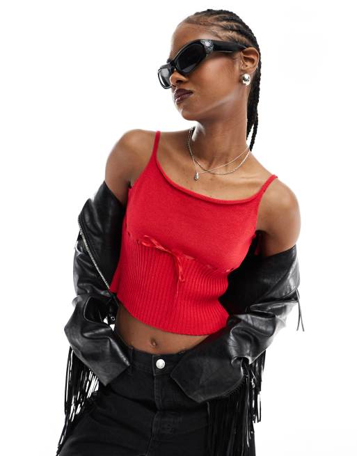 Red crop top store with black jeans