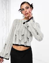 ASOS DESIGN Petite knitted top with sheer asymmetric detail in