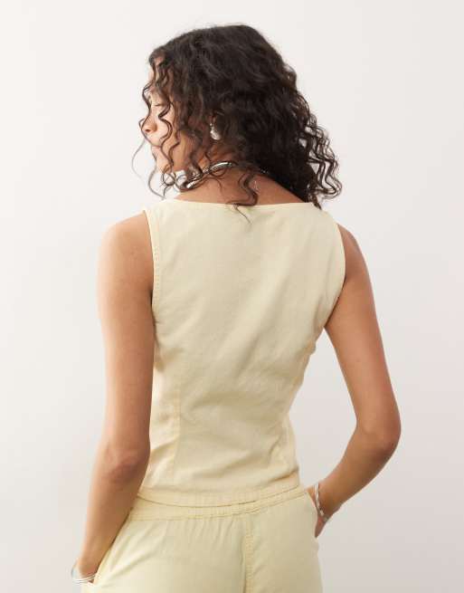 COLLUSION – Ljusgul, åtsmitande topp i linnestil med hjärtformad ringning, del av set, 4 av 4