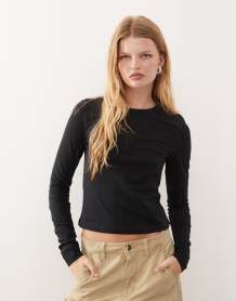 ASOS DESIGN Petite high rise barrel leg jeans in black