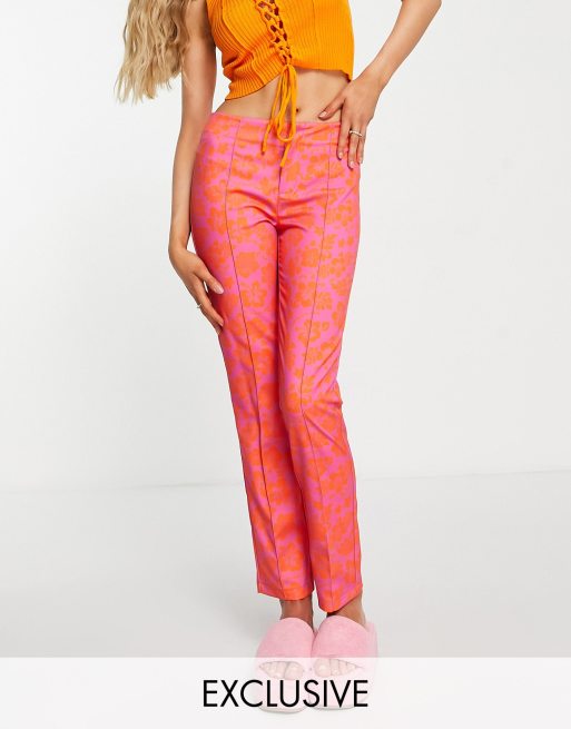 COLLUSION low rise slim hibiscus print pants in pink