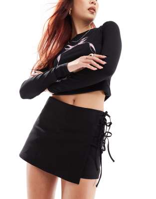 low rise wrap skort with tie detail in black