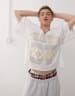 COLLUSION Skater relaxed jersey shorts in tree camo print - MULTI