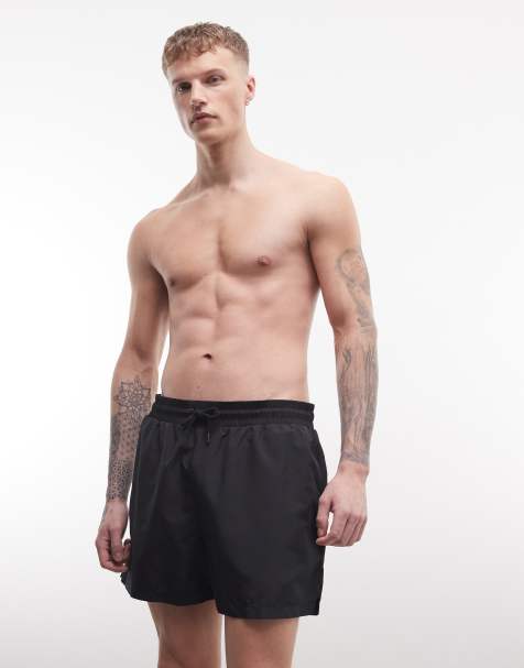 COLLUSION mid length swim short in black - view 1