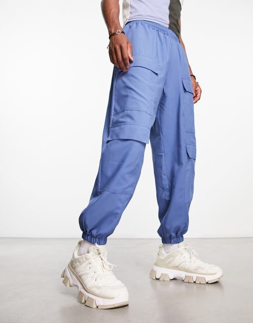COLLUSION nylon pocket detail cargo trackies in blue