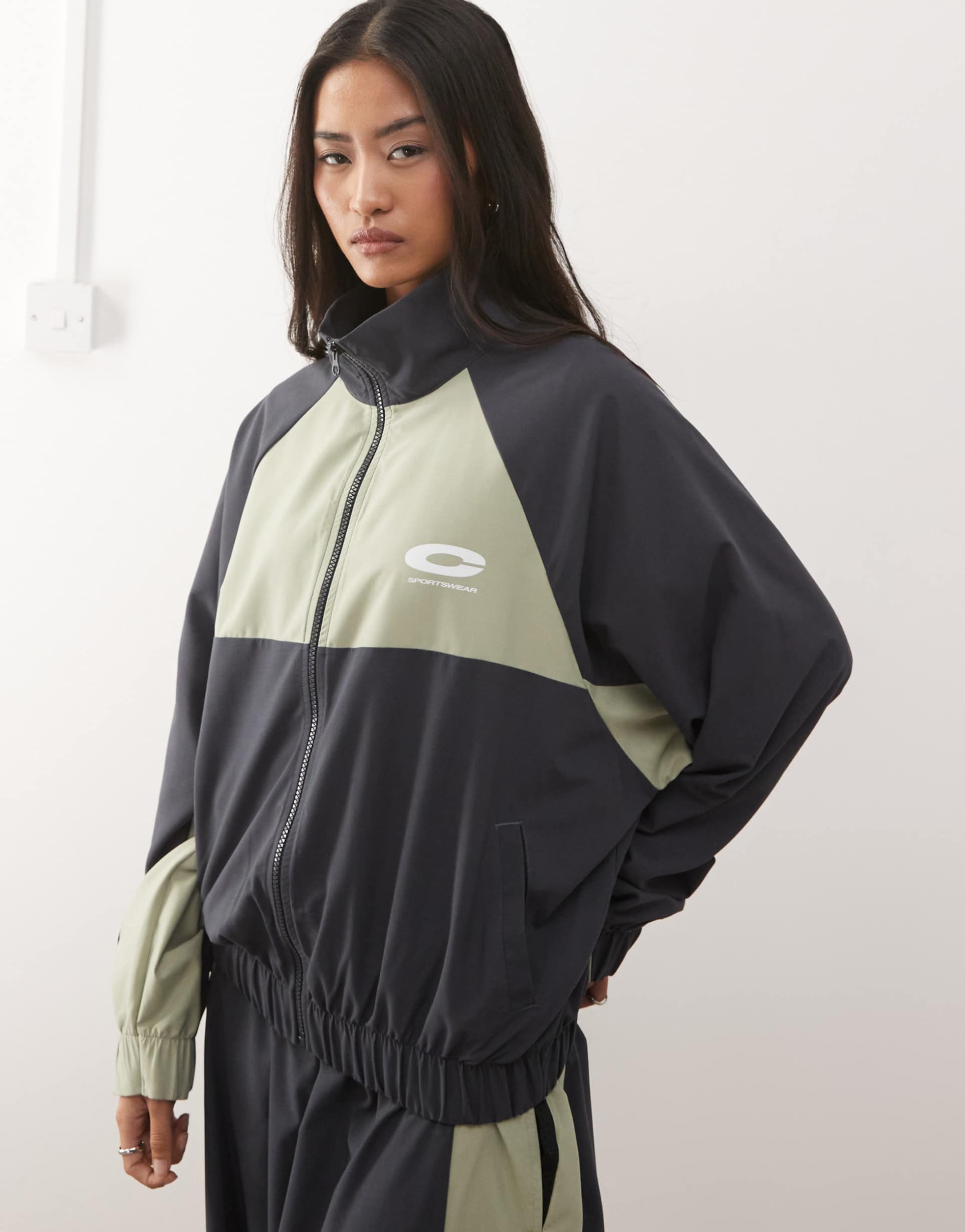 collusion nylon sports funnel neck jacket in black and khaki - part of a set