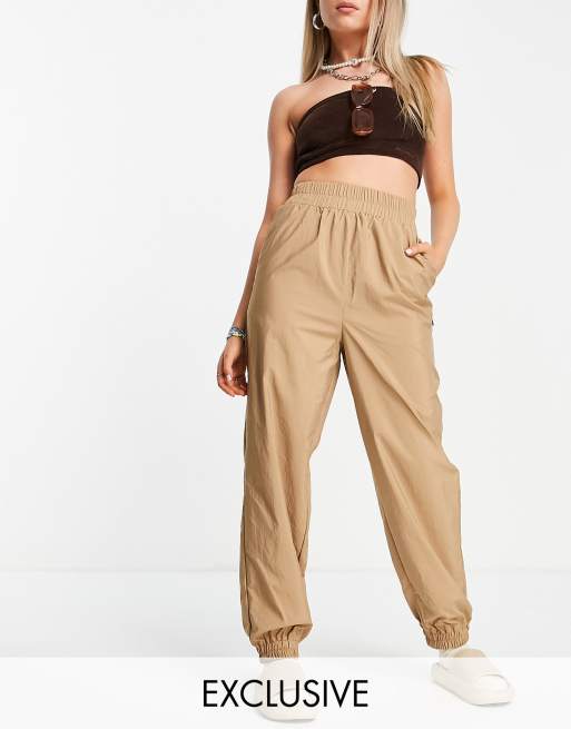 COLLUSION nylon sweatpants in beige