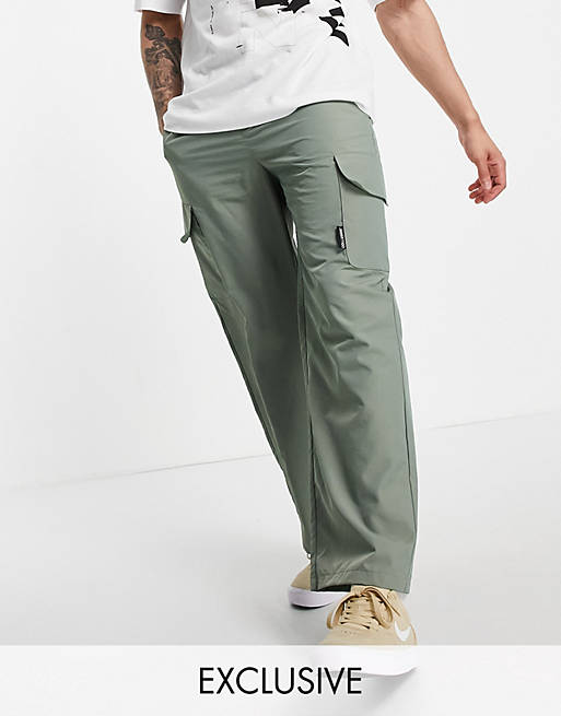 COLLUSION nylon wide leg cargo trousers with pockets in green