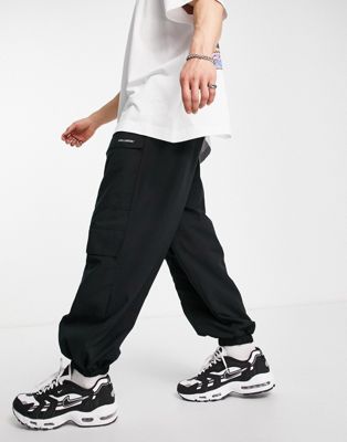 COLLUSION oversized cargo joggers in black