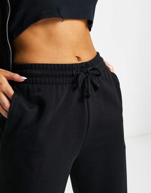 COLLUSION Plus oversized sweatpants with branded bum print in