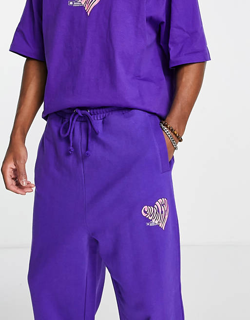 Tracksuits COLLUSION oversized joggers with logo heart print in purple acid wash 