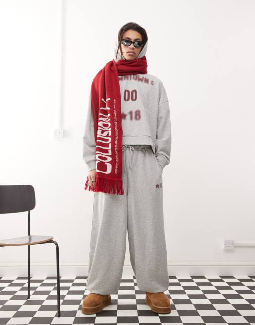 COLLUSION overszied cuffed trackies with burgundy print in grey marl (part of a set)