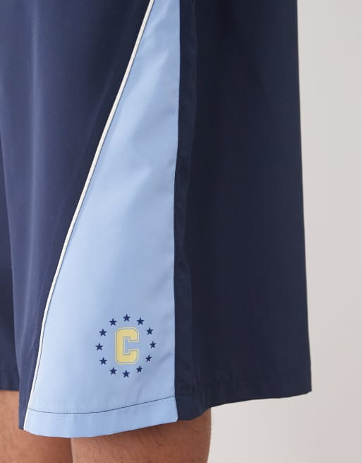 COLLUSION paneled soccer style shorts in blue