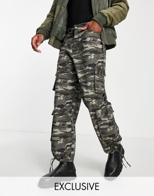 Homme COLLUSION - Pantalon cargo baggy à taille basse à motif camouflage - Kaki