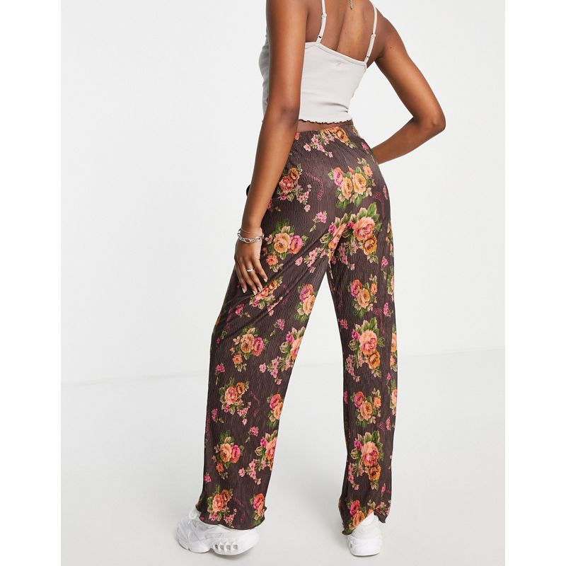 Pantaloni e leggings rfZwR COLLUSION - Pantaloni dritti plissé con stampa a fiori multicolore 