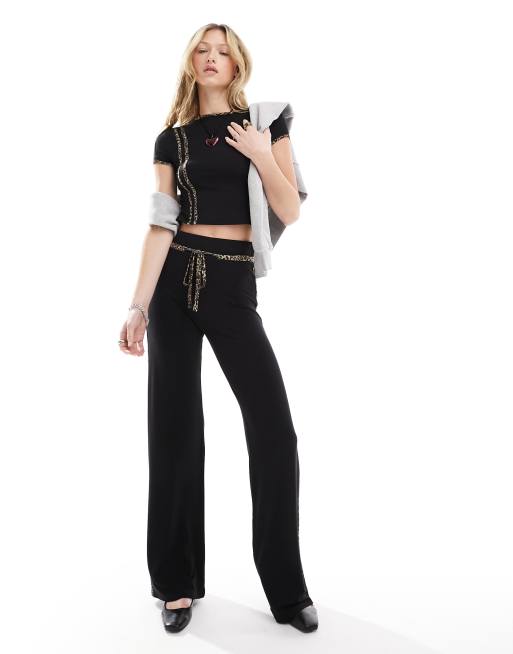 COLLUSION Pantaloni larghi neri con dettagli con stampa animalier in coordinato ASOS