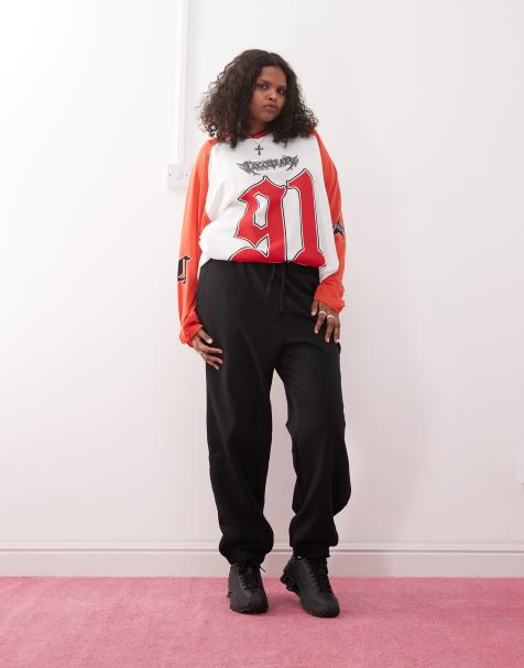 COLLUSION Plus oversized cuffed trackies in black - view 1
