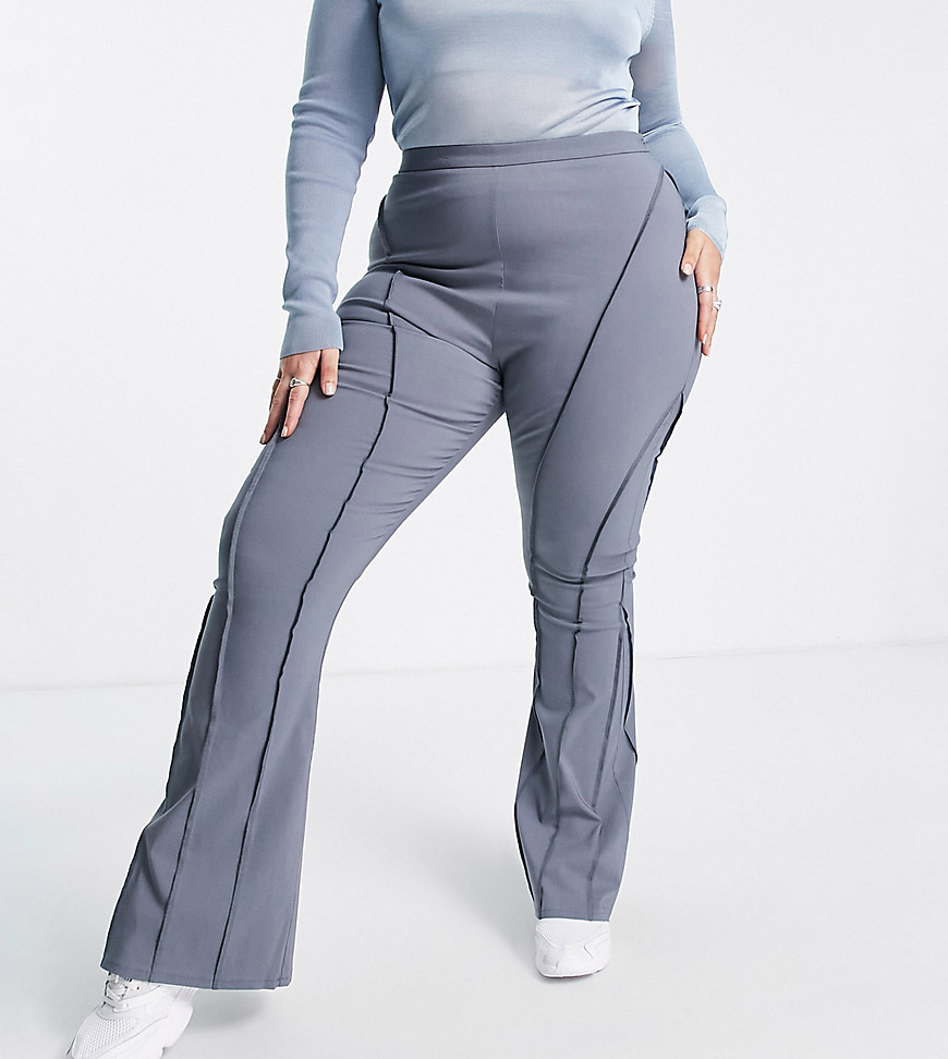 Plus-size trousers by COLLUSION Exclusive to ASOS High rise Exposed seams Zip-side fastening Flared slim fit