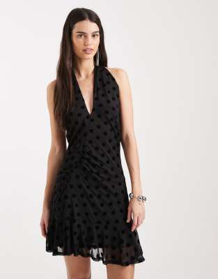 Collusion Polka Dot Flocked Cross Halter Flippy Mini Dress-black In Black