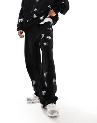 COLLUSION relaxed joggers with hand paint spray in black co-ord