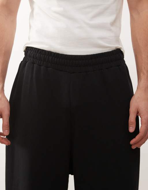 COLLUSION Relaxed skate sweatpants in black