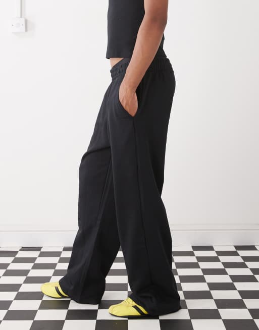 COLLUSION Relaxed skate sweatpants in black