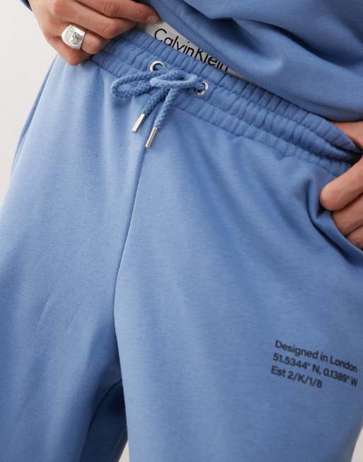 COLLUSION Relaxed skate joggers with co-ordinates in blue