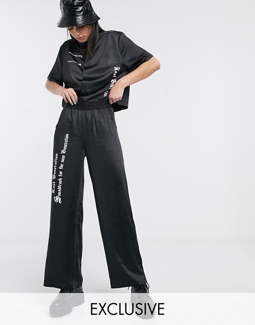 COLLUSION satin trouser with gothic print in black