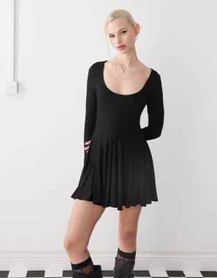 scoop neck flippy hem mini dress in black