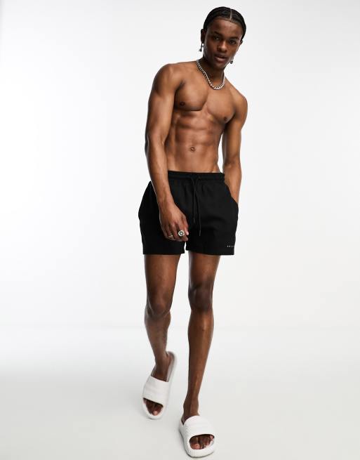 ASOS DESIGN swim shorts in super short length in black